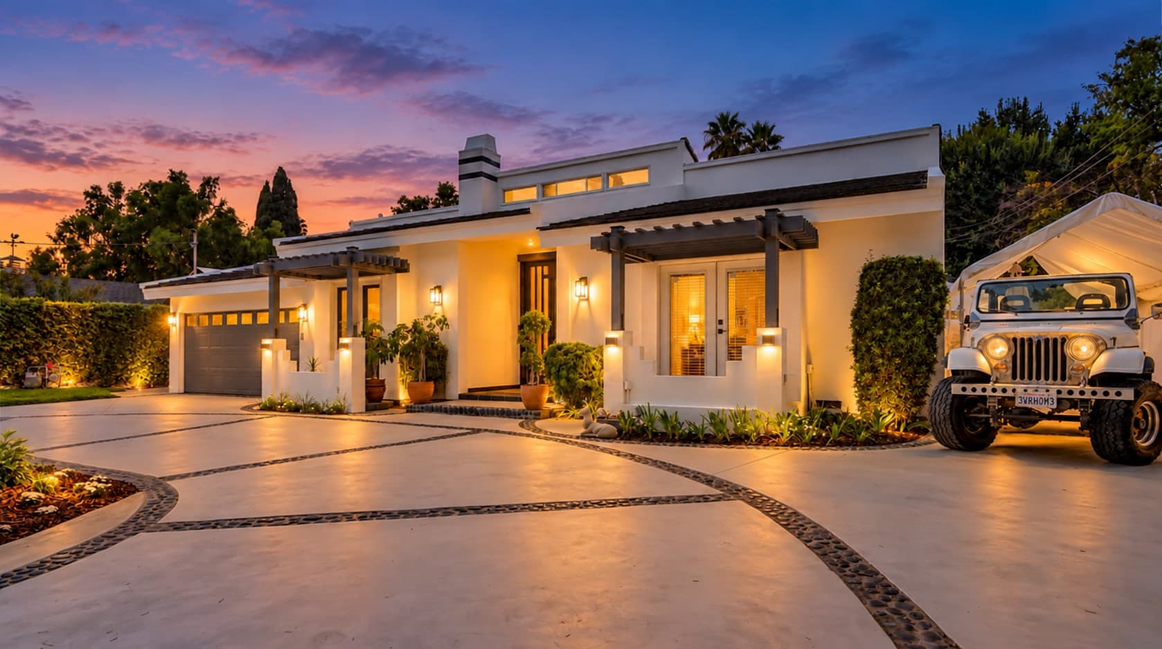 Same home at dusk with the lights on